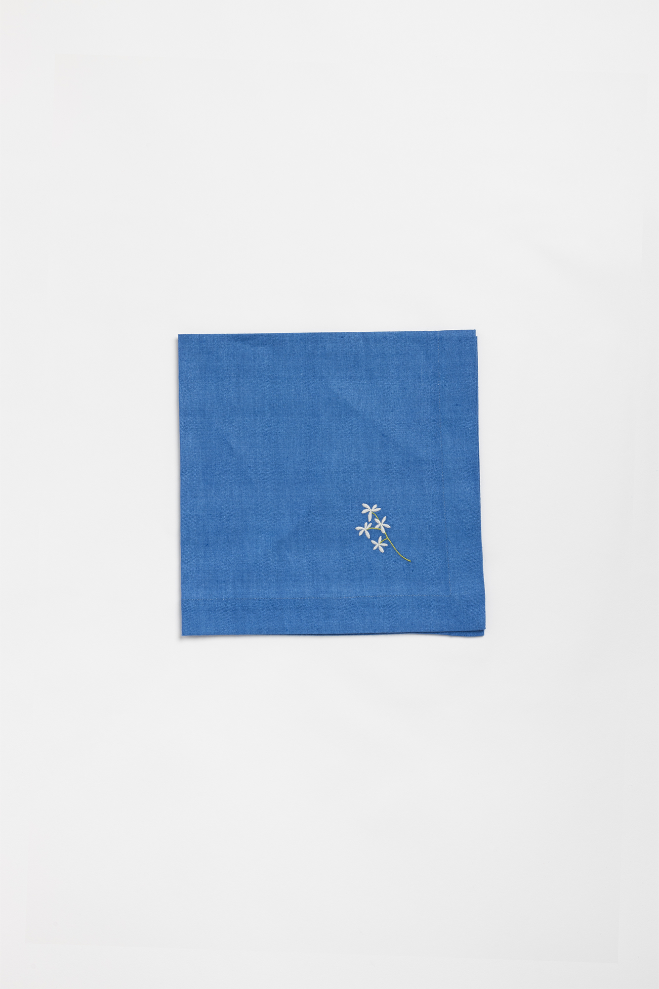 "Flowers" napkin in Capri Blue